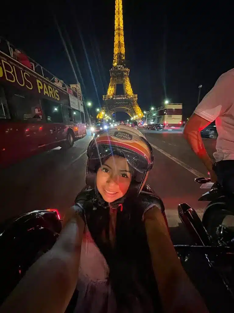 Selfie in front of the Eiffel Tower at night