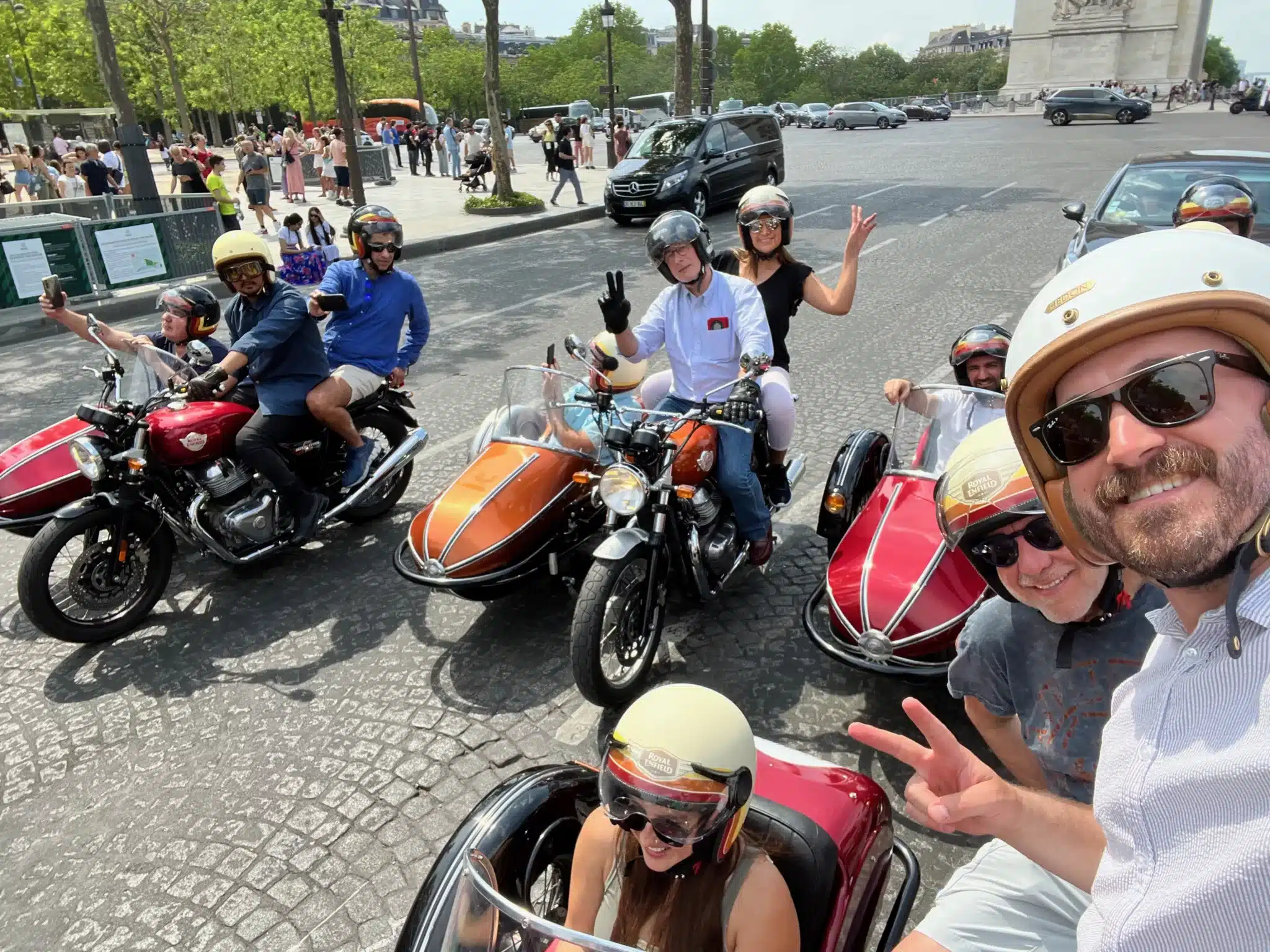 A group of friends are having a blast on a retro sidecar tour